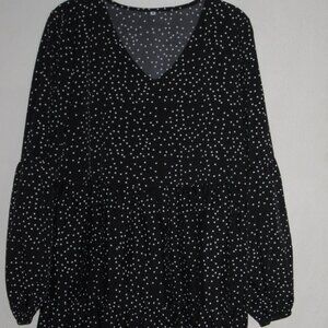 Two Black Tiered Long Sleeved Dresses One Gingham Print the Other Polka Dots